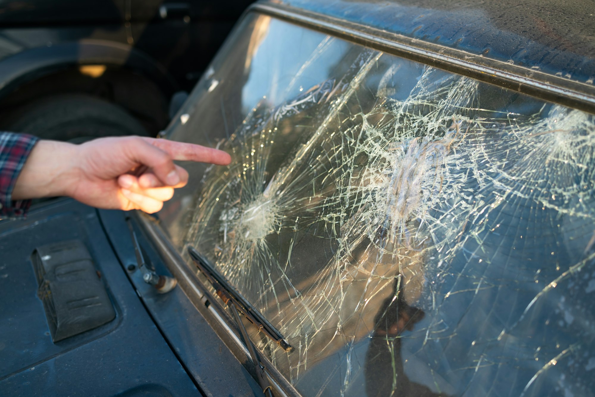 Broken car front window. the broken windshield in car accident